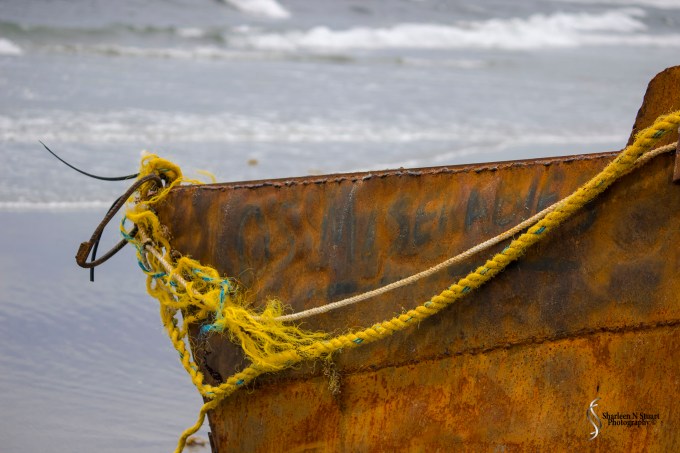 Frayed ropes are tied to the boat