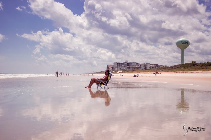 This is the life. A beach are and a beautiful day.