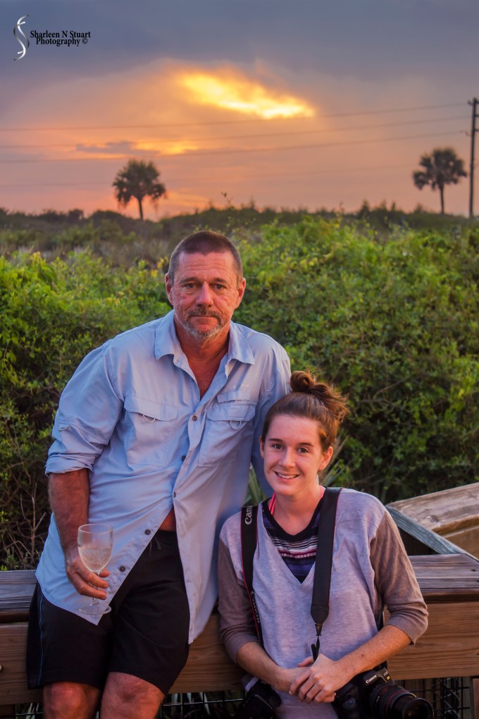 Richard and Amy enjoying the sunset - with a camera and a glass of wine